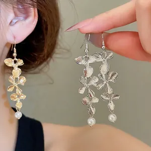 Elegant silver triple-layered flower earrings with pearl drop tassel for women