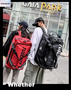 Detailed view of durable Oxford fabric backpacks in red and black for outdoor travel