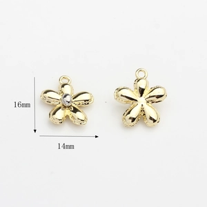 Detail view of 16mm x 14mm gold flower alloy charms with silver centers for jewelry DIY