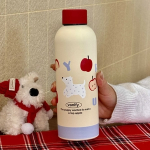 Insulated stainless steel apple themed water bottle with cream body and red lid