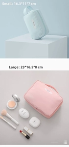 Waterproof travel cosmetic bags in pink and blue sizes with convenient top handles
