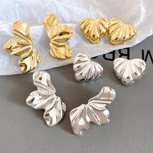 Textured acrylic heart and leaf stud earrings in polished gold and silver finishes