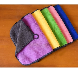 Macro view of multi-color thickened microfiber towels with hanging loops and gray backing