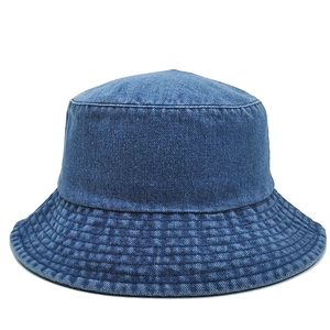 Close-up of deep blue denim bucket hat with multi-row stitching on brim and flat top design