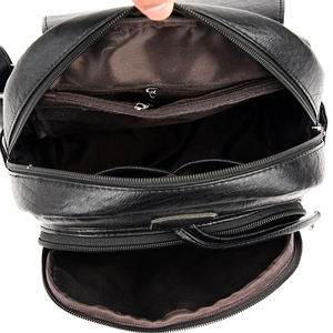 Black sheepskin texture backpack with spacious interior zipper compartments and pockets