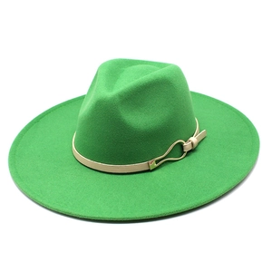 Detail of green wool fedora with wide brim and beige leather band with gold buckle