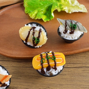 Macro detail of miniature sushi bowls featuring realistic resin rice and colorful toppings