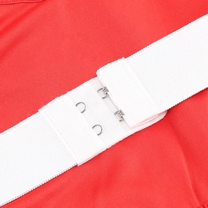 Detail of red sequin dress showing white elastic straps and metal hook closures