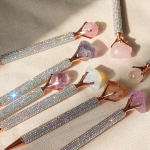 Rose gold metal ballpoint pens with natural crystal stones and sparkling diamond accents
