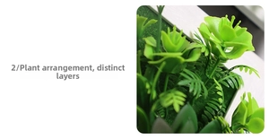 Detailed wall art featuring artificial succulents and ferns in a white wooden frame