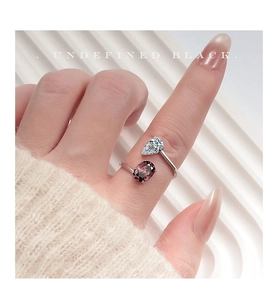 Detail of s925 silver irregular open ring featuring water drop and oval gemstones