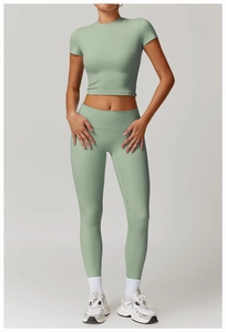 Front view of mint green high-waisted yoga set including cropped tee and leggings