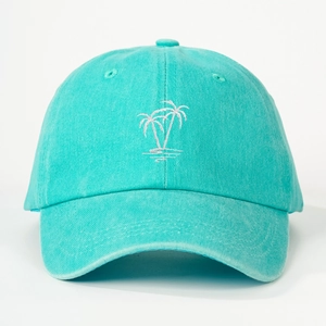 Close-up of white palm tree embroidery on a mint blue cotton twill baseball cap
