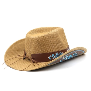 Vintage straw cowboy hat with blue floral embroidery and a wide brim for sun protection