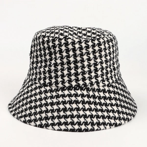 Detail of classic black and white houndstooth pattern on thick wool bucket hat