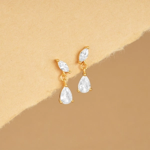 Close-up of gold drop earrings featuring marquise and waterdrop cut clear crystals