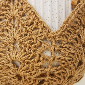 Handmade woven jute rope plant hanger with decorative hollow pattern and white ceramic pot