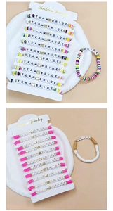 Detailed view of Team Bride colorful polymer clay bead bracelets with gold heart accents