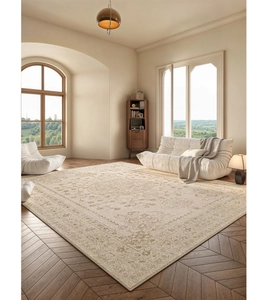 Detail of vintage French floral rug on wooden floor with beige classical Persian patterns