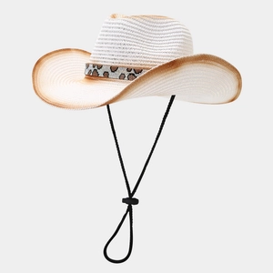 Detail of white straw cowboy hat with leopard print band and adjustable chin strap