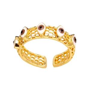 Bague ouverte dorée avec motif alvéolé et cinq charmes œil protecteur pour femme