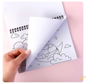 Detail of spiral bound coloring book with unicorn line art on bright pink background