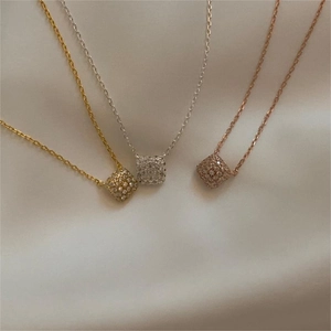 Macro shot of 925 sterling silver square pendants with full cubic zirconia pave in 3 colors