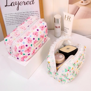 Elegant floral print cosmetic bags with delicate lace trim for travel makeup storage