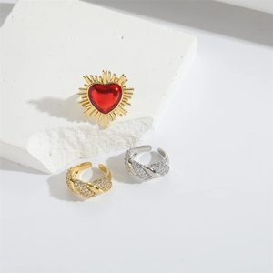 Minimalist gold heart ring set with red crystal and sparkling twisted pave open rings