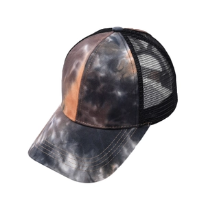 Close-up of tie-dye baseball cap featuring breathable mesh and triple-stitched brim