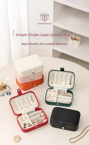 Multi-compartment PU leather jewelry box organizer showing necklace hooks and ring slots