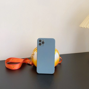 Blue silicone phone case displayed with a yellow round smiley face shoulder bag