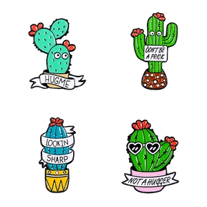 Set of four cute cartoon cactus enamel pins with humorous English slogans on white background