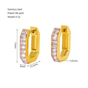 Detailed view of U-shaped gold earrings with pink zircon dimensions 17mm by 13.5mm