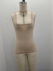 Detail of slim fit beige camisole with thin straps and square neckline in milk silk