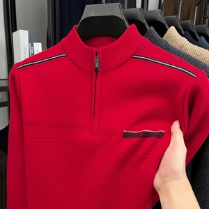Detail of red men's sweater with half-zip stand collar and striped shoulder knitting