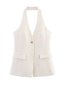 Detail of cream halter vest top featuring a deep V-neck and vintage gold button closure