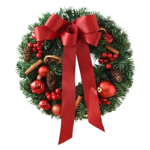 Christmas wreath with red bow, pine cones, and berries for holiday door decor
