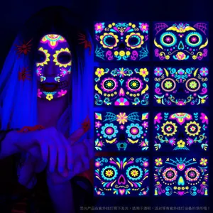 Detail view of 8 UV fluorescent Halloween face tattoos with glowing skeleton and floral patterns