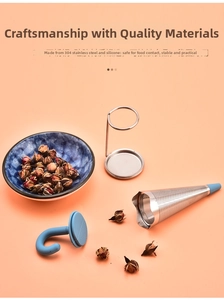 Detail of 304 stainless steel tea infuser with blue silicone handle on pink background