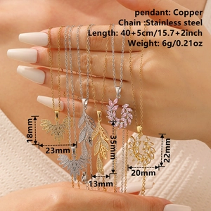 Elegant stainless steel leaf and feather pendant necklaces with zirconia in gold and silver