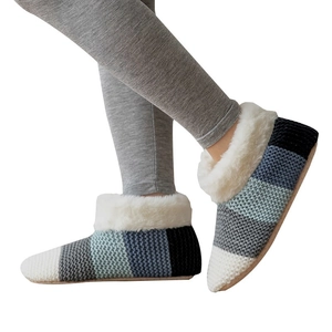 Women's sherpa-lined knit slipper socks with striped pattern and white plush cuffs