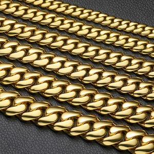 Polished gold Cuban link chains in various sizes displayed on a black leather texture