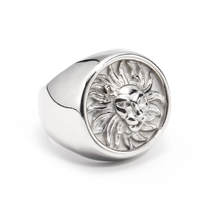 Detailed view of carved lion head relief on silver stainless steel signet ring for men
