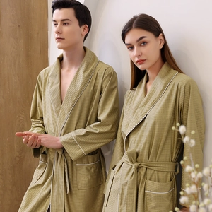 Olive green waffle knit bathrobes for couples featuring contrast piping and belt closure