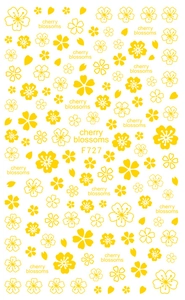 Détail macro des stickers ongles fleurs de cerisier jaunes F727 avec texte décoratif