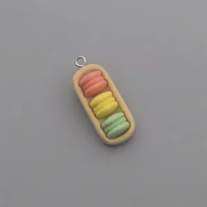 Detailed view of resin three-color macaron charm with a silver metal loop for DIY crafts