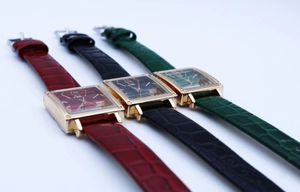 Detailed view of square quartz watches with crocodile texture leather straps in three colors
