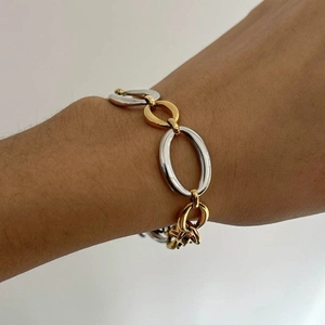 Minimalist two-tone stainless steel bracelet with polished gold and silver oval links