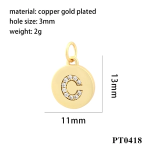 Detailed view of gold-plated copper pendant featuring zircon-inlaid letter C design